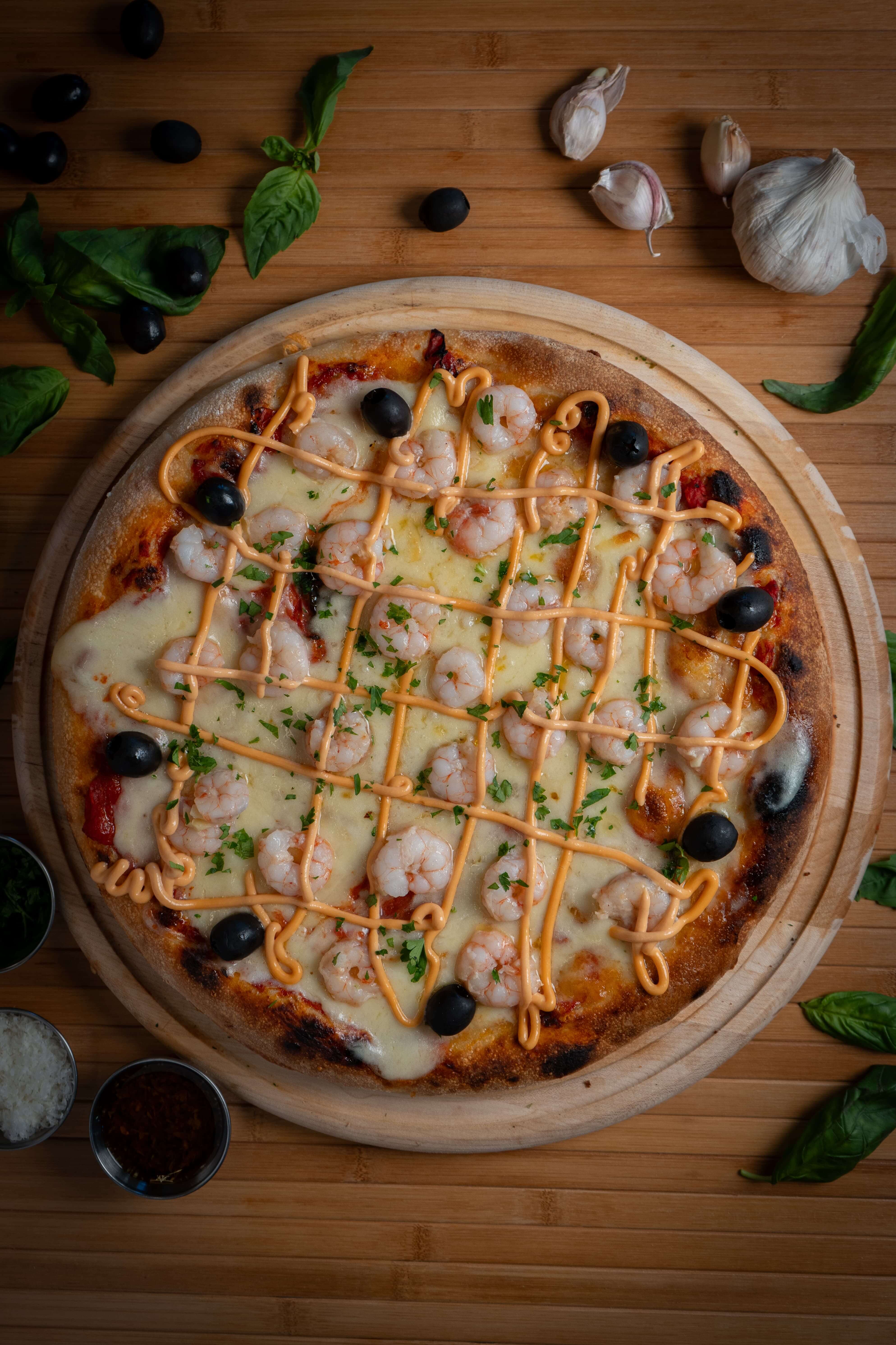 Pizzas artesanales con salsa de tomate San Marzano y mozzarella Argentina